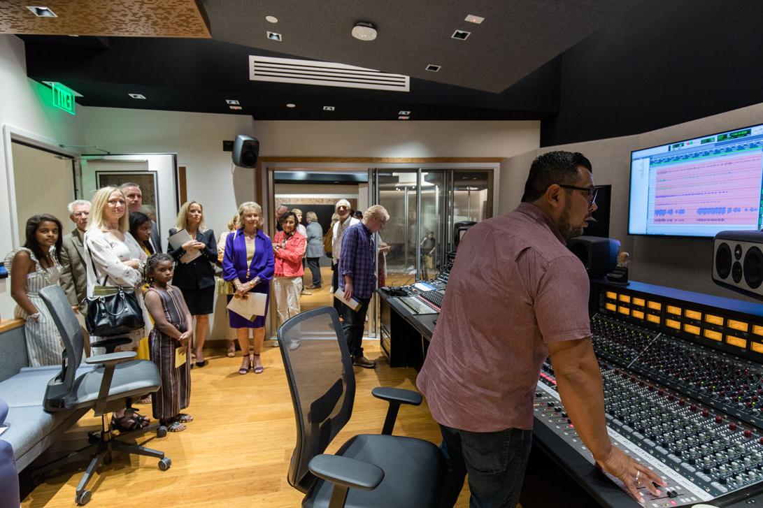 People touring the new recording studio in the BMC